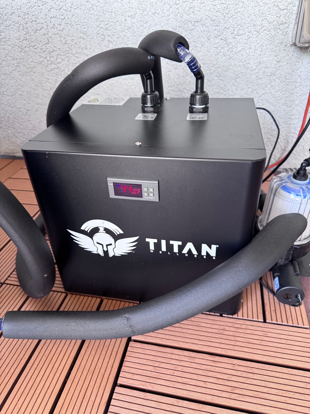 Customer review photo of Titan chiller on wood deck with insulated hoses connected, 44°F digital display, inline 20 micron filter and pump