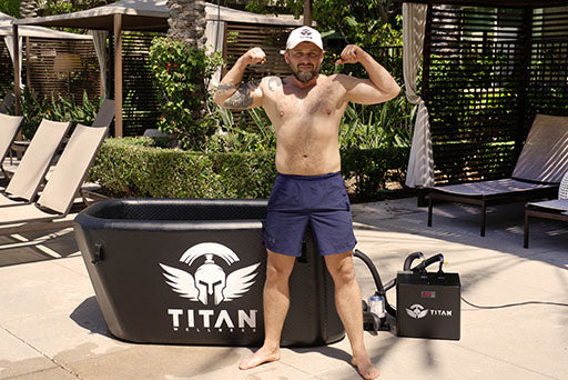 A person flexing in front of a Titan Chiller and Triumph Cold Plunge